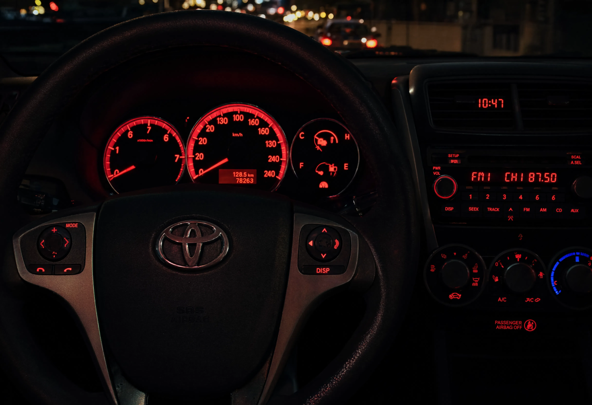 Red Lit Car Dashboard At Night