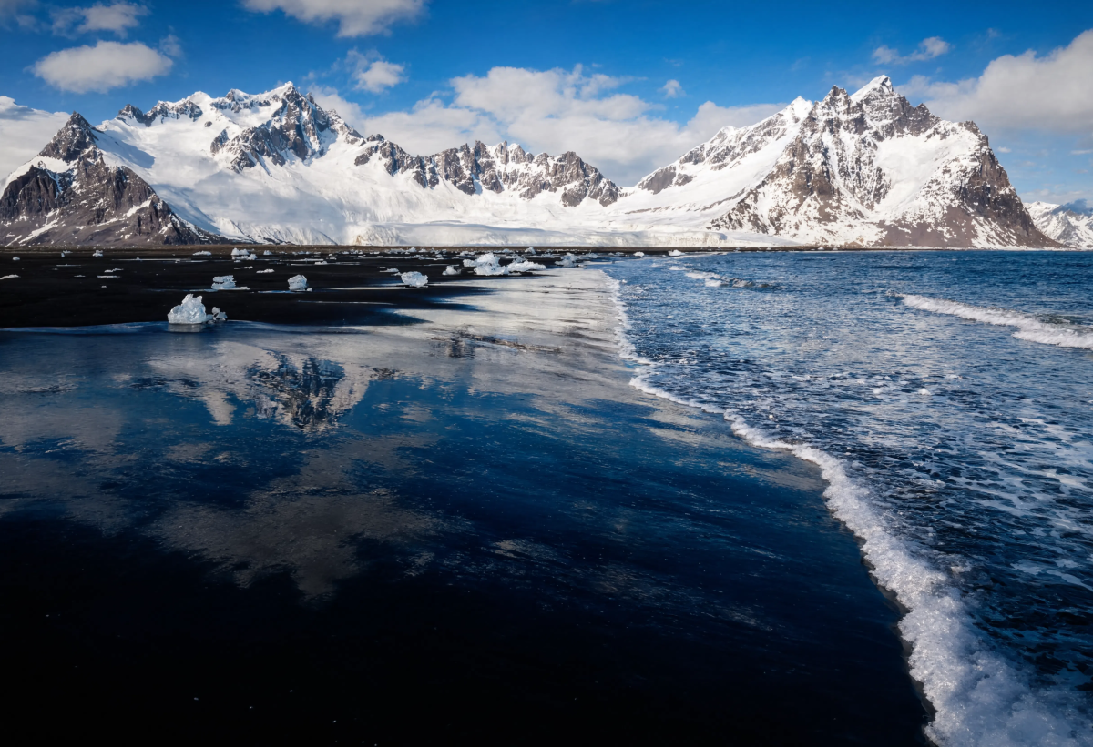 Black sand mountain reflection