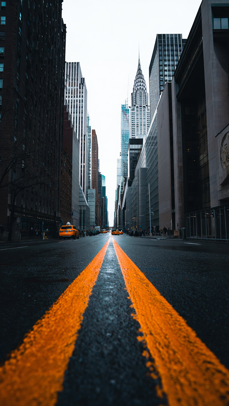 A dramatic urban photograph captured in Manhattan features the iconic Chrysler Building framed by modern office towers