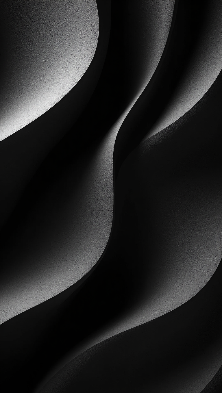 A black and white photographic image features smooth, curved abstract forms captured in extreme close-up