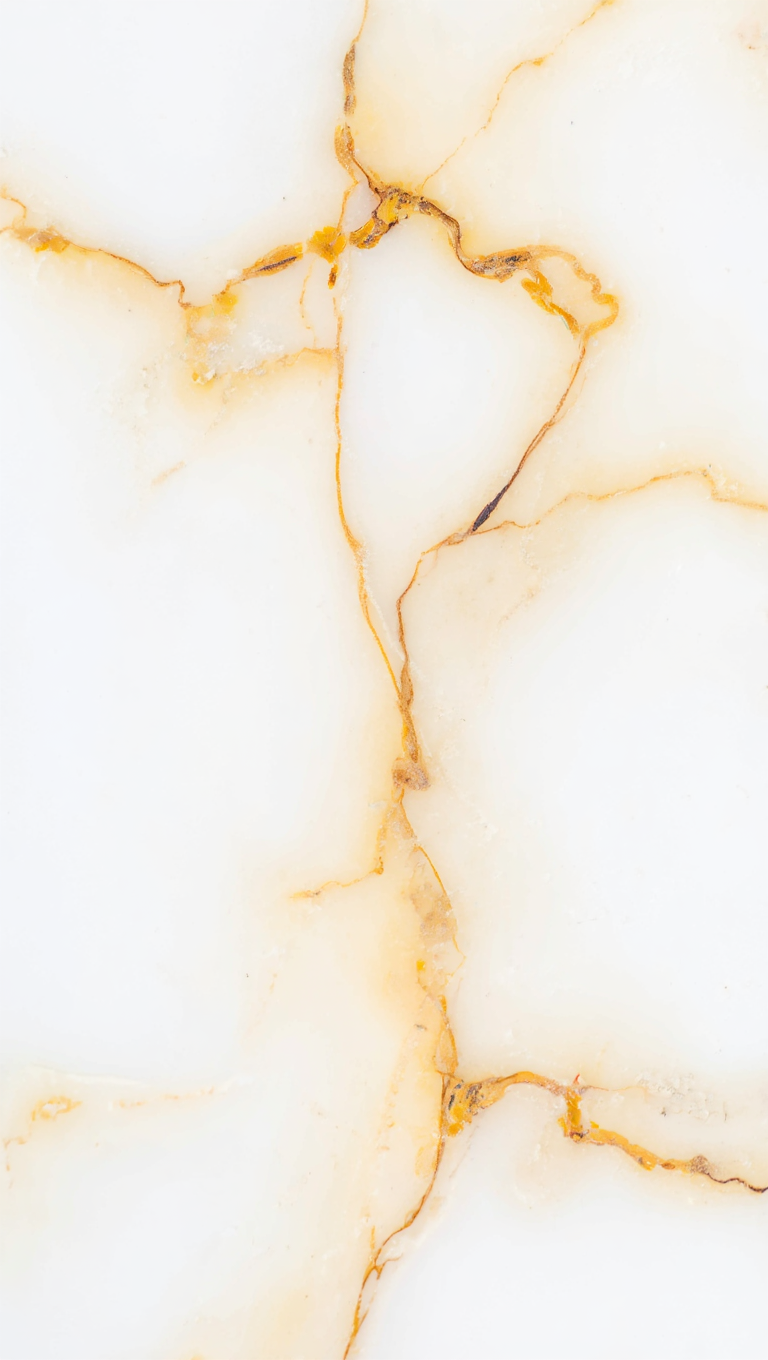 A macro photography of a polished white marble surface with thin, branching veins of gold and brown